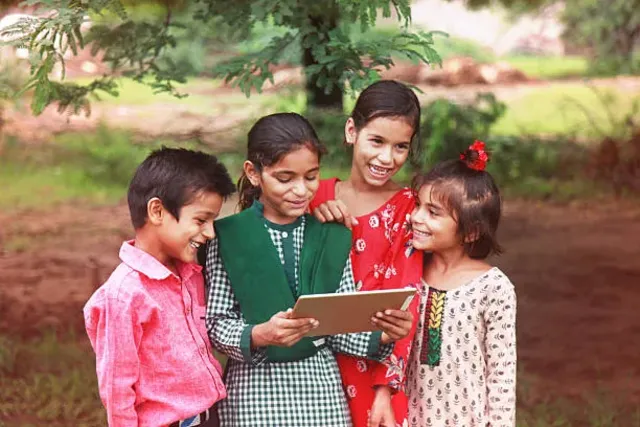 Two children sharing a tablet.
